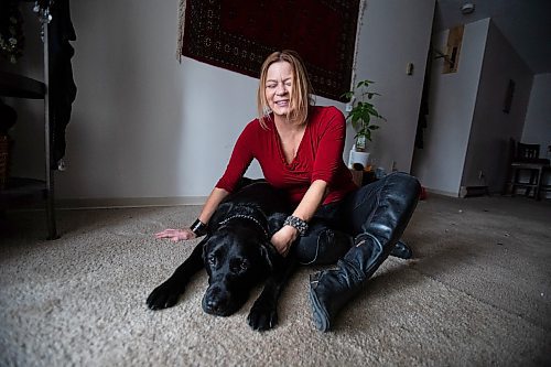 Daniel Crump / Winnipeg Free Press. Veronika Kanya and her guide dog Apache photographed in the living room of Kanya&#x2019;s home. Veronika became blind at age 25 and teaches jujitsu as a self defence instructor. December 8, 2021.