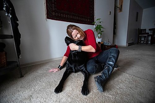 Daniel Crump / Winnipeg Free Press. Veronika Kanya and her guide dog Apache photographed in the living room of Kanya&#x2019;s home. Veronika became blind at age 25 and teaches jujitsu as a self defence instructor. December 8, 2021.