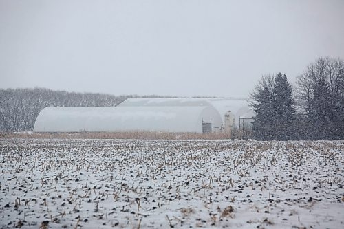 MIKE DEAL / WINNIPEG FREE PRESS
Structures on the Birkland Farms Ltd property which is south of Winkler, MB, close to the U.S. border.
211208 - Wednesday, December 08, 2021.