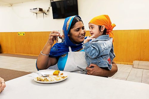 PRABHJOT SINGH / WINNIPEG FREE PRESS

Beant Kaur is seen with her grandson Har rubab singh. It was his birthday so his family had volunteered to arrange and serve food at the gurdwara on the day.

In the community kitchen of Gurdwara Singh Sahab on Sturgeon Road in Winnipeg, a five-course meal is prepared by a host of Sikh devotees for the weekly Sunday langar.

