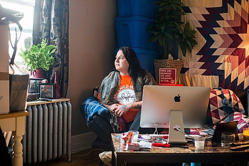 MIKAELA MACKENZIE / WINNIPEG FREE PRESS

Alaya McIvor poses for a portrait at her work station where she's been answering calls around the clock for a donation drive for residential school survivors in Winnipeg on Thursday, Dec. 9, 2021. For Tyler story.
Winnipeg Free Press 2021.