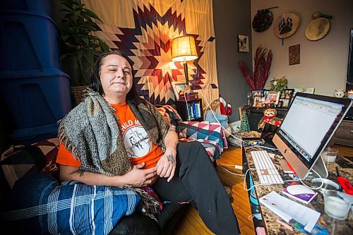 MIKAELA MACKENZIE / WINNIPEG FREE PRESS

Alaya McIvor poses for a portrait at her work station where she's been answering calls around the clock for a donation drive for residential school survivors in Winnipeg on Thursday, Dec. 9, 2021. For Tyler story.
Winnipeg Free Press 2021.