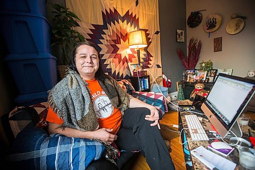 MIKAELA MACKENZIE / WINNIPEG FREE PRESS

Alaya McIvor poses for a portrait at her work station where she's been answering calls around the clock for a donation drive for residential school survivors in Winnipeg on Thursday, Dec. 9, 2021. For Tyler story.
Winnipeg Free Press 2021.