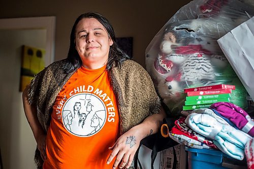 MIKAELA MACKENZIE / WINNIPEG FREE PRESS

Alaya McIvor poses for a portrait with Christmas donations for residential school survivors in Winnipeg on Thursday, Dec. 9, 2021. For Tyler story.
Winnipeg Free Press 2021.