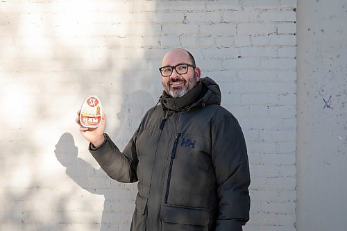 JESSICA LEE / WINNIPEG FREE PRESS

Matt Cohen holds a can of ham on December 10, 2021 in the Exchange District. The product is advertised on the side of a building near Bannatyne and Main.

Reporter: Ben










