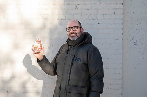 JESSICA LEE / WINNIPEG FREE PRESS

Matt Cohen holds a can of ham on December 10, 2021 in the Exchange District. The product is advertised on the side of a building near Bannatyne and Main.

Reporter: Ben









