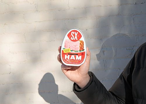JESSICA LEE / WINNIPEG FREE PRESS

Matt Cohen holds a can of ham on December 10, 2021 in the Exchange District. The product is advertised on the side of a building near Bannatyne and Main.

Reporter: Ben










