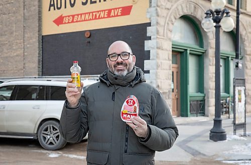 JESSICA LEE / WINNIPEG FREE PRESS

Matt Cohen holds a can of ham and lemon polish on December 10, 2021 in the Exchange District. The two products are advertised on the side of buildings near Bannatyne and Main.

Reporter: Ben










