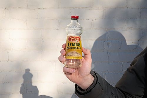 JESSICA LEE / WINNIPEG FREE PRESS

Matt Cohen holds a bottle of lemon polish on December 10, 2021 in the Exchange District. The product is advertised on the side of a building near Bannatyne and Main.

Reporter: Ben











