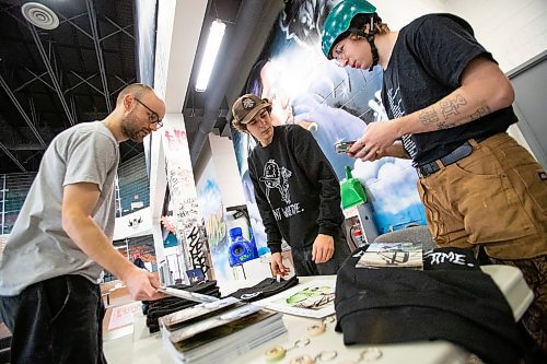 Daniel Crump / Winnipeg Free Press. Jackson Toone, creator of the Don&#x574; Waste Time skateboarding zine mans table at the launch for his zine&#x573; fifth issue at The Edge Skatepark in downtown Winnipeg on Saturday. December 11, 2021.