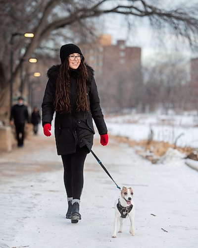 Mike Sudoma / Winnipeg Free Press
Ricki Bates and her pup Ruka enjoy a walk along the river trail by the Manitoba Legislature grounds Monday afternoon
December 13, 2021 