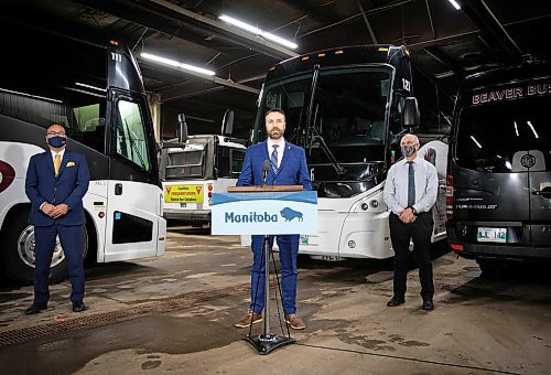 JESSICA LEE / WINNIPEG FREE PRESS

Lagimodi&#xe8;re MLA Andrew Smith (centre) announces with Economic Development and Jobs Minister Jon Reyes (left) and John Fehr, General Manager of Beaver Bus Lines, a $1.92-million program to support bus and air charter companies affected by the COVID-19 pandemic on December 13, 2021 at Beaver Buslines head office.


Reporter: Gabby










