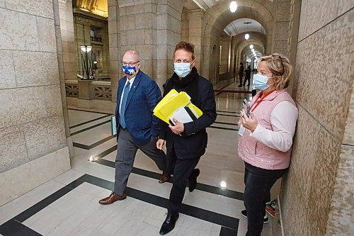 MIKE DEAL / WINNIPEG FREE PRESS
Minister of Infrastructure, Ron Schuler (centre) and Minister of Legislative and Public Affairs, Kelvin Goertzen (left), leave Wednesday's cabinet meeting ignoring questions from Winnipeg Free Press reporter Carol Sanders (right).
See Carol Sanders story
211215 - Wednesday, December 15, 2021.