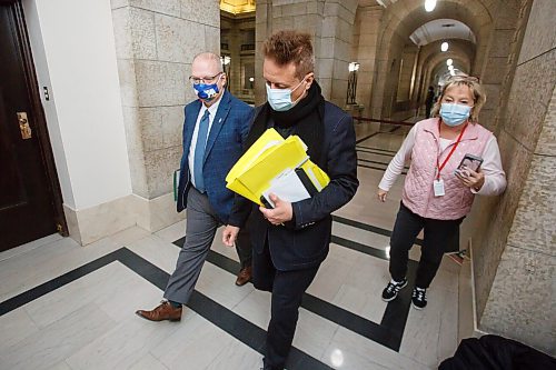 MIKE DEAL / WINNIPEG FREE PRESS
Minister of Infrastructure, Ron Schuler (centre) and Minister of Legislative and Public Affairs, Kelvin Goertzen (left), leave Wednesday's cabinet meeting ignoring questions from Winnipeg Free Press reporter Carol Sanders (right).
See Carol Sanders story
211215 - Wednesday, December 15, 2021.