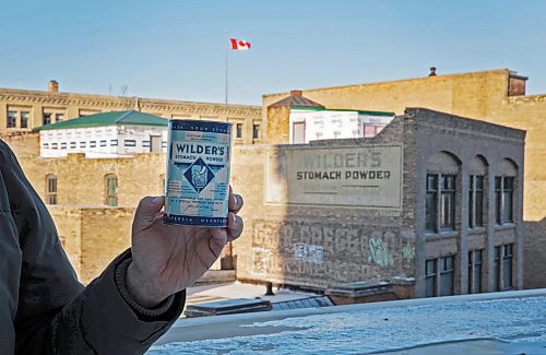 JESSICA LEE / WINNIPEG FREE PRESS



An advertisement on the side of a building in the Exchange District which advertises Wilder&#x2019;s stomach powder is photographed side by side with the product on December 10, 2021. The can is held by Matt Cohen, an advertising professional who collaborated with the Winnipeg Architecture Foundation on an 80-page walking tour book designed to showcase a selection of the Exchange District&#x2019;s ghost signs.



Reporter: Ben