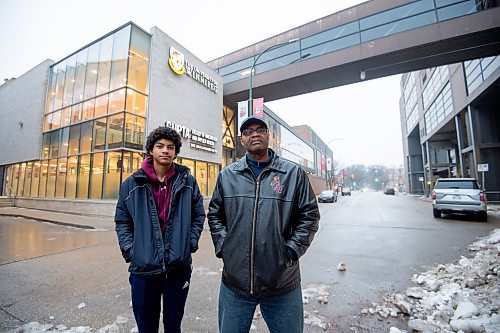 Mike Sudoma / Winnipeg Free Press
Kevin Toney and his son Kai in front of Duckworth centre at the University of Winnipeg Wednesday
December 15, 2021 