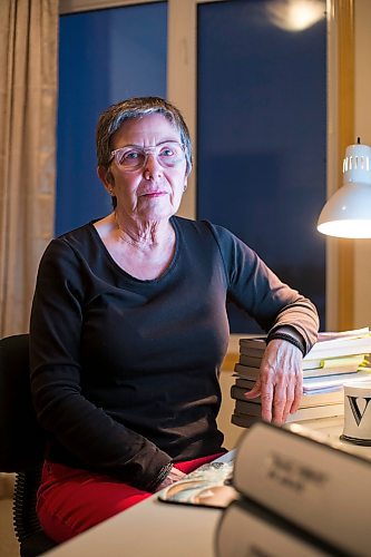 MIKAELA MACKENZIE / WINNIPEG FREE PRESS

Virginia Page J&#xe4;hne, a 72-year-old PhD student at the U of M who is hesitant about the university's plans to fully reopen to pre-pandemic levels in early 2022, poses for a portrait in her home work space in Winnipeg on Thursday, Dec. 16, 2021. For Maggie story.
Winnipeg Free Press 2021.