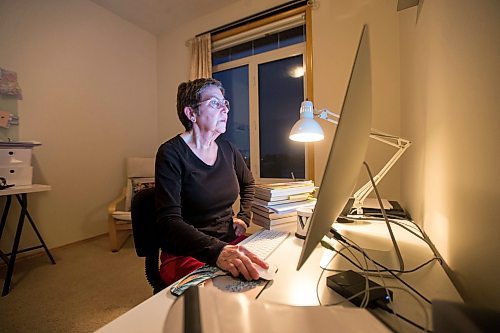 MIKAELA MACKENZIE / WINNIPEG FREE PRESS

Virginia Page J&#xe4;hne, a 72-year-old PhD student at the U of M who is hesitant about the university's plans to fully reopen to pre-pandemic levels in early 2022, poses for a portrait in her home work space in Winnipeg on Thursday, Dec. 16, 2021. For Maggie story.
Winnipeg Free Press 2021.