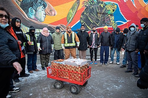 JESSICA LEE / WINNIPEG FREE PRESS

Elijah Woodhouse (in tan jacket), with his family and community members of Main Street Project, hold hands in a prayer after arriving to Main Street Project after a 231 km walk to raise awareness about addiction and homelessness on December 17, 2021. Woodhouse handed out snacks while walking and also gathered clothing and money donations for the Main Street Project.














