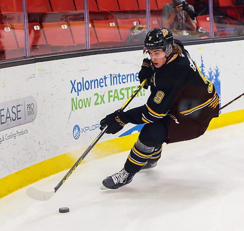 Brandon Sun Brandon Wheat Kings left wing Riley Ginnell and Edmonton Oil Kings centre Cole Milier race around the end boards in a Western Hockey League game Friday at Westoba Place. (Chelsea Kemp/The Brandon Sun)