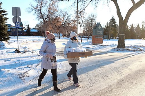 RUTH BONNEVILLE / WINNIPEG FREE PRESS
 
Local - Riverview Fireworks 

Riverview volunteers Brenda Neumann (pink toque) and Krystal Patey, deliver to the  invitations (to watch the display) to about 250 homes around Riverview on Monday morning.

For the second year, local commercial realtor Cushman &amp; Wakefield Stevenson is putting on a huge fireworks display on New Year's Eve at Riverview. In fact, it's three displays to ensure it's visible to people in every corner of the facility.

The fireworks are a big thank for the care given to Patricia McGarry, who spent her final days in care at Riverview and whose sons run Cushman &amp; Wakefield Stevenson.It sounds like the company plans to do something every year from here on in, whether fireworks or a carnival or whatever.



Dec 20th,  2021
