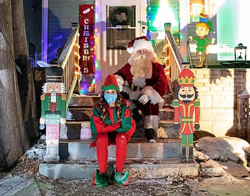 JESSICA LEE / WINNIPEG FREE PRESS

Alexis Johnson, who organizes bookings for Scheme a Dream, poses for a photo with Santa on December 22, 2021, near her home.











