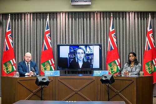 MIKAELA MACKENZIE / WINNIPEG FREE PRESS

Chief provincial public health officer Dr. Brent Roussin (left), medical lead of the Manitoba Vaccine Task Force Dr. Joss Reimer, and health minister Audrey Gordon speak at a press conference asking the public to adjust their holiday plans at the Manitoba Legislative Building in Winnipeg on Friday, Dec. 24, 2021.  For Malak story.
Winnipeg Free Press 2021.