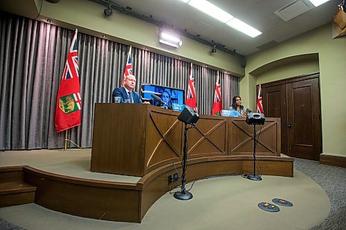 MIKAELA MACKENZIE / WINNIPEG FREE PRESS

Chief provincial public health officer Dr. Brent Roussin (left) and health minister Audrey Gordon speak at a press conference asking the public to adjust their holiday plans at the Manitoba Legislative Building in Winnipeg on Friday, Dec. 24, 2021.  For Malak story.
Winnipeg Free Press 2021.