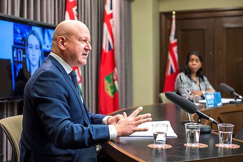 MIKAELA MACKENZIE / WINNIPEG FREE PRESS

Chief provincial public health officer Dr. Brent Roussin (left) and health minister Audrey Gordon speak at a press conference asking the public to adjust their holiday plans at the Manitoba Legislative Building in Winnipeg on Friday, Dec. 24, 2021.  For Malak story.
Winnipeg Free Press 2021.