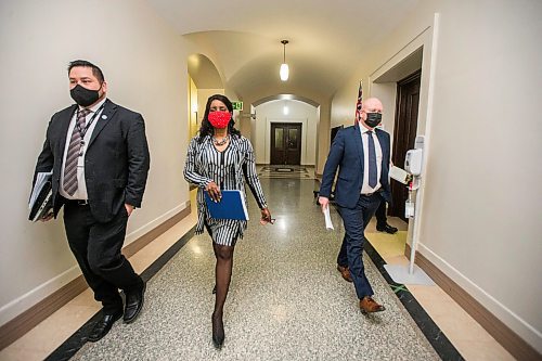 MIKAELA MACKENZIE / WINNIPEG FREE PRESS

Health minister Audrey Gordon (centre) and chief provincial public health officer Dr. Brent Roussin (right) walk in to speak at a press conference asking the public to adjust their holiday plans at the Manitoba Legislative Building in Winnipeg on Friday, Dec. 24, 2021.  For Malak story.
Winnipeg Free Press 2021.