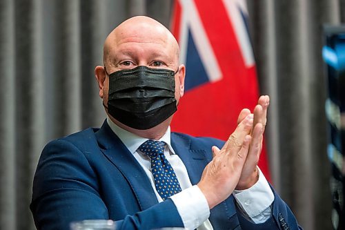 MIKAELA MACKENZIE / WINNIPEG FREE PRESS

Chief provincial public health officer Dr. Brent Roussin sanitizes his hands after a press conference asking the public to adjust their holiday plans at the Manitoba Legislative Building in Winnipeg on Friday, Dec. 24, 2021.  For Malak story.
Winnipeg Free Press 2021.