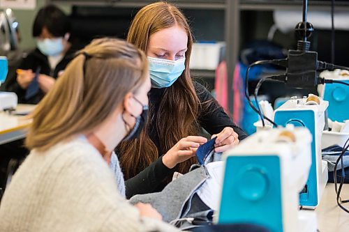 MIKAELA MACKENZIE / WINNIPEG FREE PRESS

Jessica Walker (right) and Erika Turner work on making jeans during textiles class at Shaftesbury High School in Winnipeg on Wednesday, Dec. 22, 2021. For Maggie story.
Winnipeg Free Press 2021.