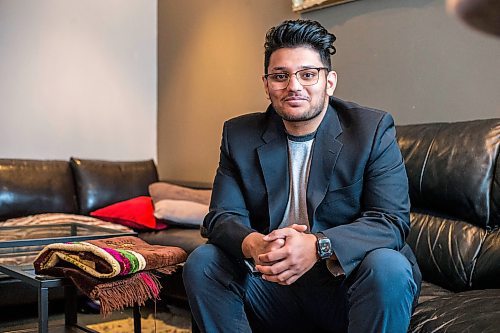 MIKAELA MACKENZIE / WINNIPEG FREE PRESS

Haseeb Ahmad poses for a portrait with a prayer mat, as he will be taking the new days off on Eid, in Winnipeg on Monday, Dec. 27, 2021.  For Bryce Hunt story.
Winnipeg Free Press 2021.