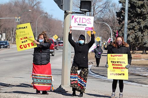 Brandon Sun Brandon School Division trustee Delvina Kejick protests Bill 64, the Education Modernization Act, alongside teachers Grace Masse and Jacqueline Sinclair at the intersection of 18th Street and Victoria Avenue on Wednesday afternoon. Around 40 local parents, educators and advocates took part in Wednesday's protest in Brandon, with a sister protest also taking place in Winnipeg at the same time. (Kyle Darbyson/The Brandon Sun)