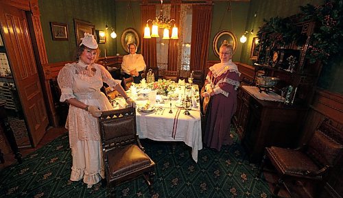 PHIL HOSSACK / WINNIPEG FREE PRESS -  left to right - Joanne Roach, Jeannie Hiebert and Calla Lofvendahl pose in the formal dining room set for a holiday feast at Dalnavert House Thursday. See Bill Redekop story. - December 20, 2016