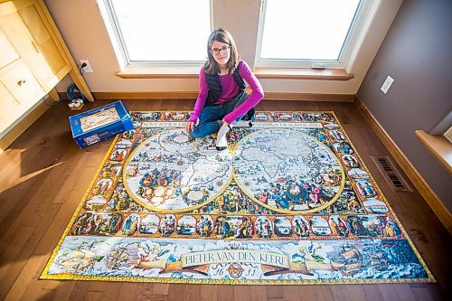 MIKAELA MACKENZIE / WINNIPEG FREE PRESS

Alexa Storozuk, 13, poses for a portrait with her completed 9,000 piece puzzle in her home in West St. Paul on Thursday, Dec. 30, 2021. For Bryce Hunt story.
Winnipeg Free Press 2021.