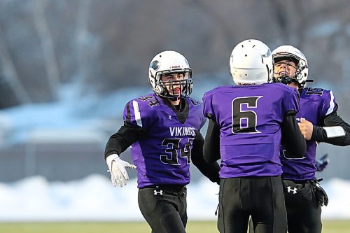 Nolan Bower, left, and Justin Sharp, right, celebrate a  Matthew Escoto (6) touchdown catch during the Vincent Massey Vikings 31-23 win over the Steinbach Sabres in the Winnipeg High School Football League's Westman Bowl at the East Side Eagles Field in Winnipeg on Thursday. (Thomas Friesen/The Brandon Sun)