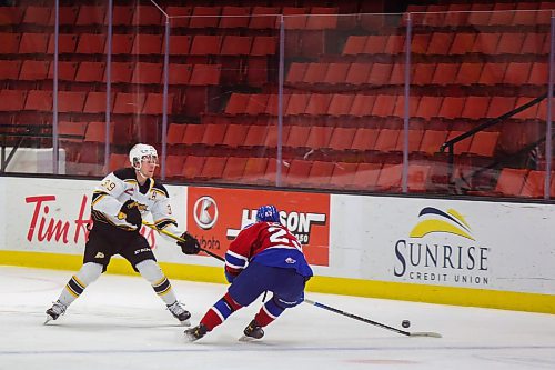 Brandon Wheat Kings defenceman Chad Nychuk, left, defends the puck from Edmonton Oil Kings forward Jalen Luypen in a Western Hockey League game Thursday at Westoba Place. (Chelsea Kemp/The Brandon Sun)