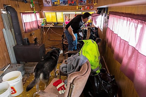 Dallas Davidson looks out the window of his ice fishing shack at Lake Wahtopanah on Tuesday, Dec. 28. (Chelsea Kemp/The Brandon Sun)