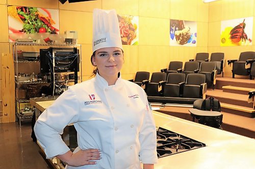 Kaitlin McCarthy poses for a photo at Assiniboine Community College's Manitoba Institute of Culinary Arts on Dec. 15. McCarthy recently became an ACC culinary arts educational assistant after graduating from the program back in 2019. (Kyle Darbyson/The Brandon Sun)