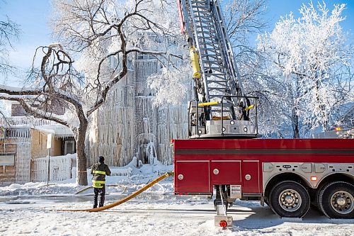 Daniel Crump / Winnipeg Free Press. Firefighters work to put out a fire that broke out New Years Eve. The blaze destroyed an apartment building near Sherbrook Street and Ellice Avenue. January 1, 2022.