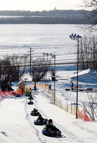 03012021
Bundled up sledders are pulled up the hill on their tubes by the tow-rope at Tubin' at Grand Valley Park on a crisp Monday afternoon. (Tim Smith/The Brandon Sun)