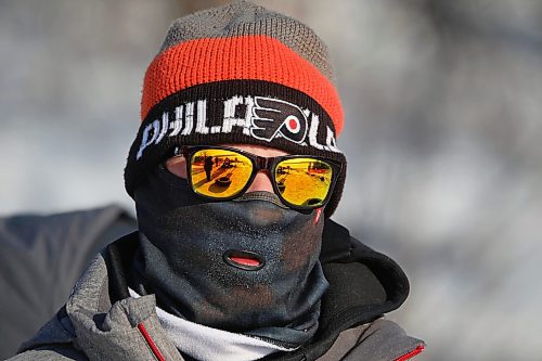 03012021
Andrew Hamilton keeps warm behind colourful sunglasses and a balaclava while sledding at Tubin' at Grand Valley Park on a crisp Monday afternoon. (Tim Smith/The Brandon Sun)