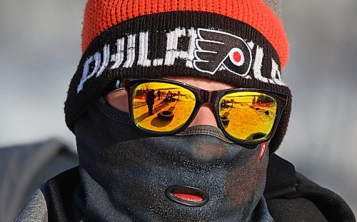 03012021
Andrew Hamilton keeps warm behind colourful sunglasses and a balaclava while sledding at Tubin' at Grand Valley Park on a crisp Monday afternoon. (Tim Smith/The Brandon Sun)