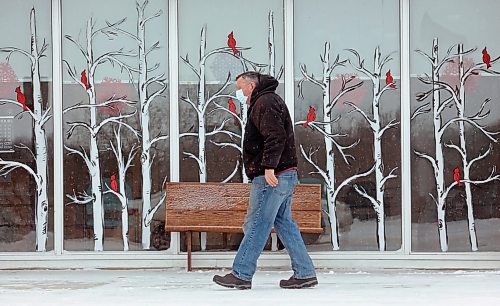 04012021
A pedestrian walks past a winter window mural in Souris on a blustery Tuesday. (Tim Smith/The Brandon Sun)