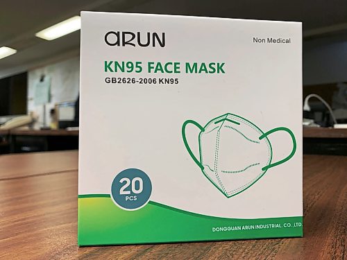 Boxes of KN95 respirator masks like these are now available at Liquor Marts in Brandon. Each person is allowed to take one box for free as long as supplies last. (Matt Goerzen/The Brandon Sun)