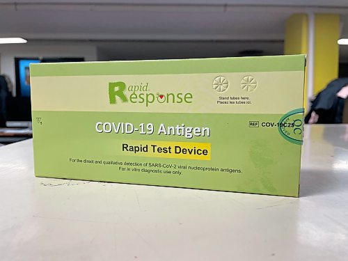 COVID-19 rapid tests like these are available for free for people who are both fully vaccinated and showing symptoms of the virus at Manitoba's testing sites, but locations across Saskatchewan are giving them away for free to anyone without verifying personal information. (Colin Slark/The Brandon Sun)