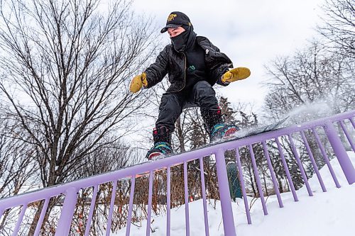 Daniel Crump / Winnipeg Free Press. Snowboarder Travis Beel hits a rail during a session with his friends at the Forks on Saturday afternoon. January 8, 2022.