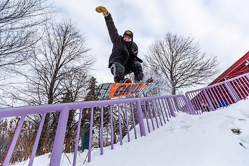 Daniel Crump / Winnipeg Free Press. Snowboarder Travis Beel hits a rail during a session with his friends at the Forks on Saturday afternoon. January 8, 2022.