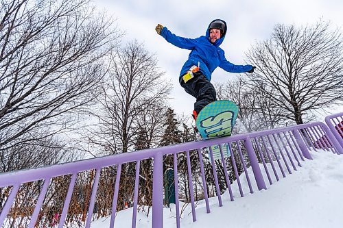 Daniel Crump / Winnipeg Free Press. Snowboarder Kyle Walker hits a rail during a session with his friends at the Forks on Saturday afternoon. January 8, 2022.